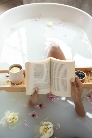 Relaxing in a bath with a book